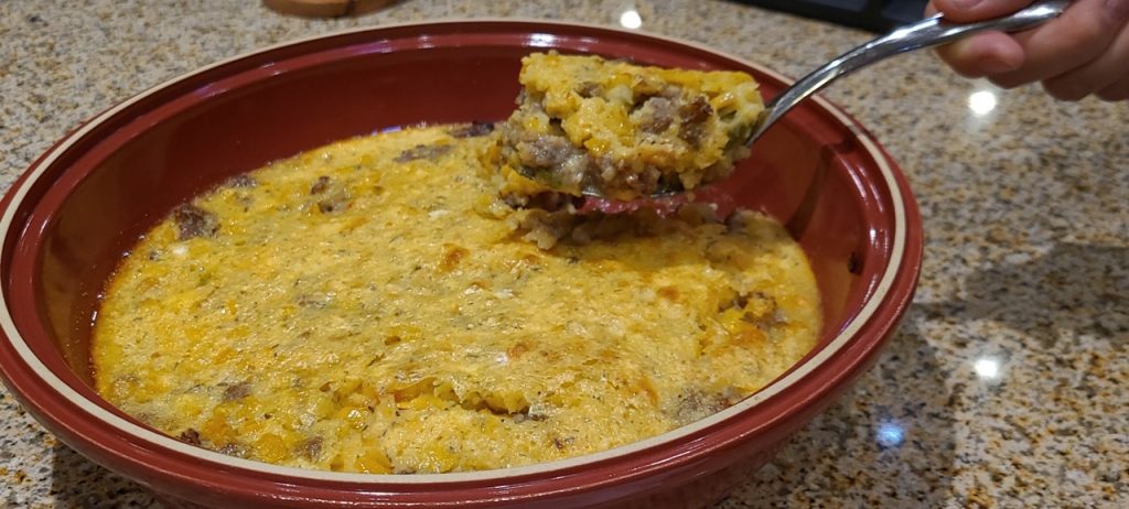 Corn Pudding with sausage and vegetables transforms a side dish to an entree casserole.